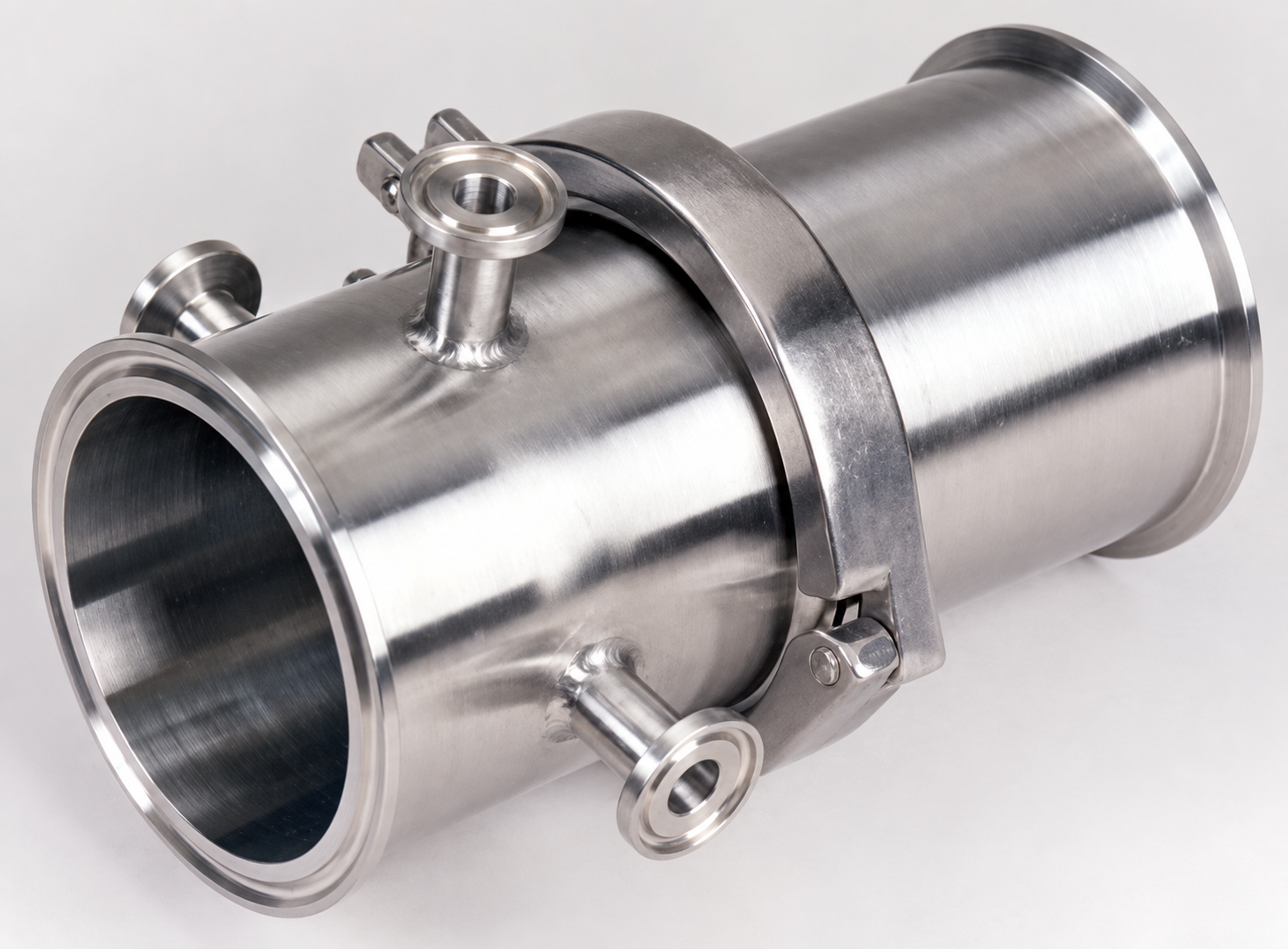 Cylindrical stainless-steel CaviFlo static cavitation mixer with clamped connections and small side ports.