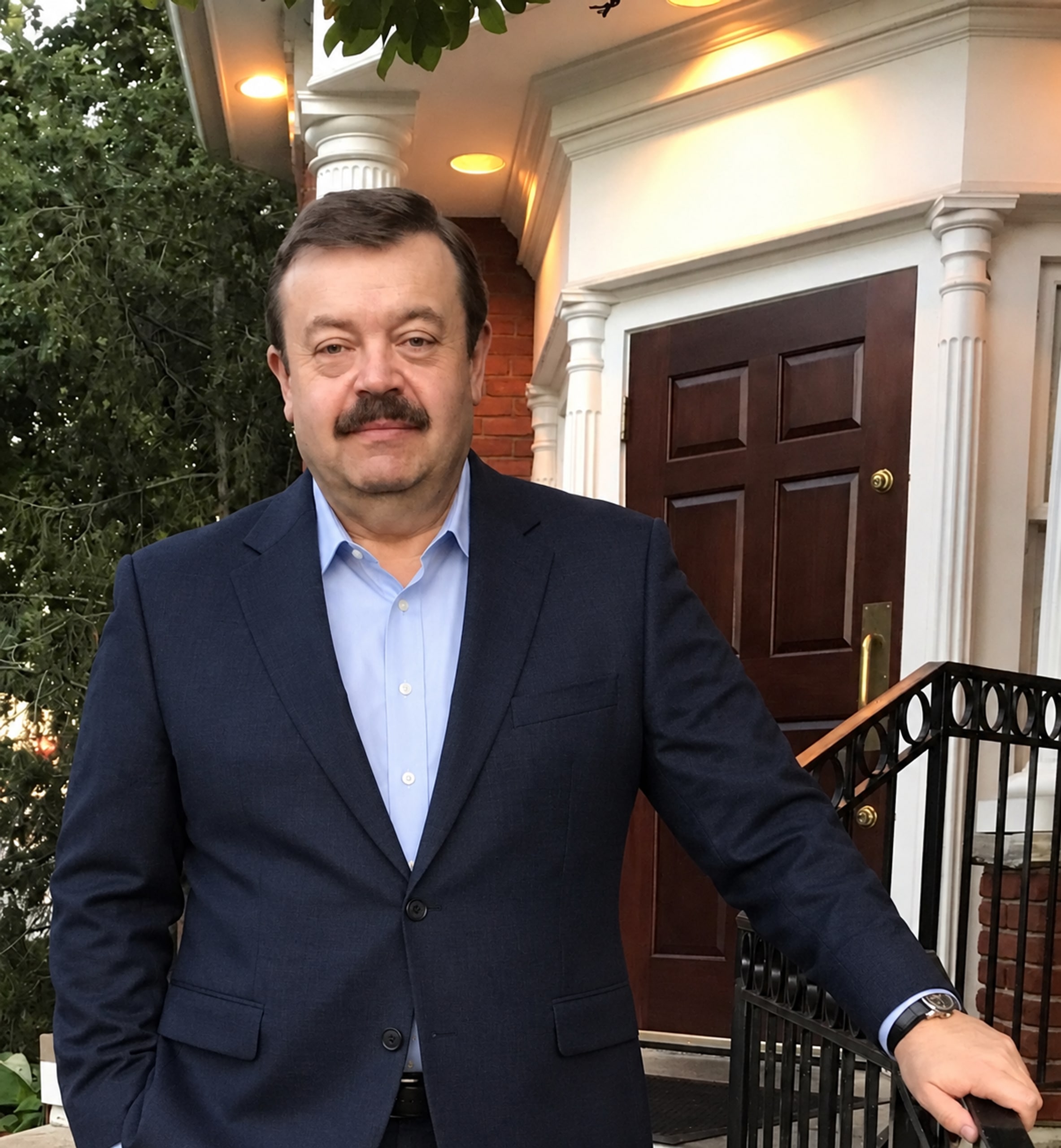 Portrait of Dr. Oleg V. Kozyuk in a business suit.