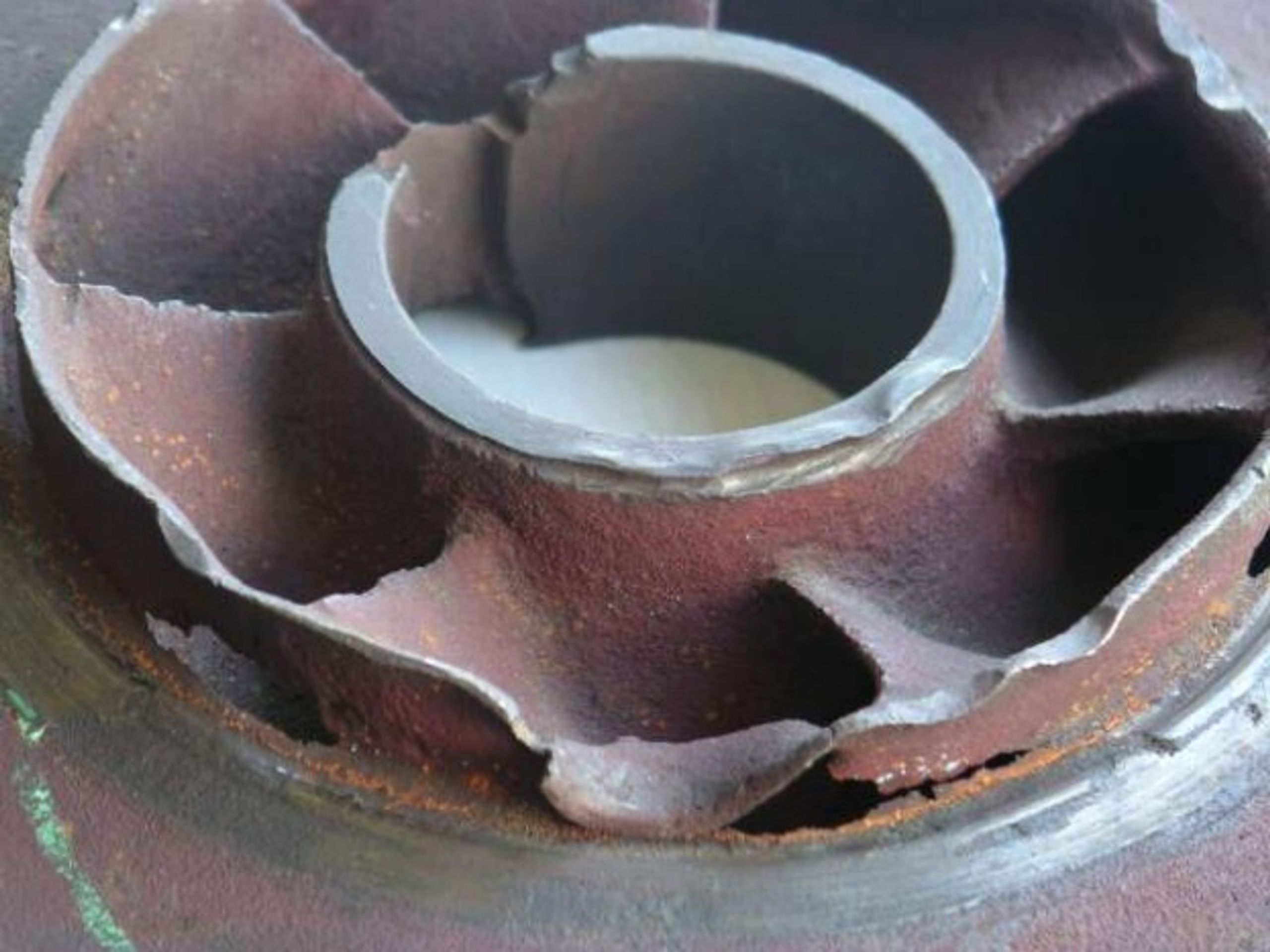 Figure 3. Photograph of cavitation damage and material loss on a centrifugal pump impeller
