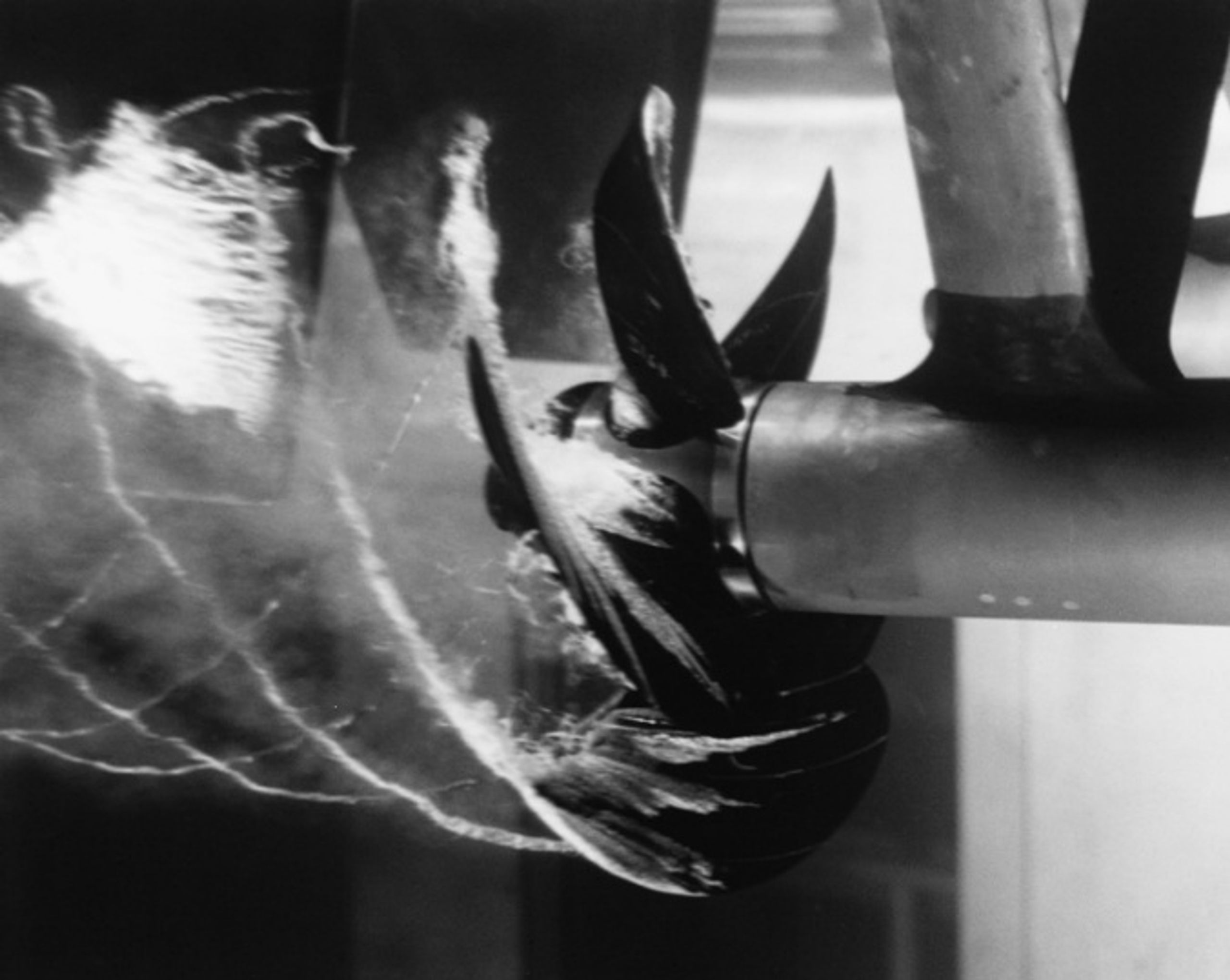 Figure 5. U.S. Navy photograph of a cavitating marine propeller operating in a water tunnel at the David Taylor Model Basin